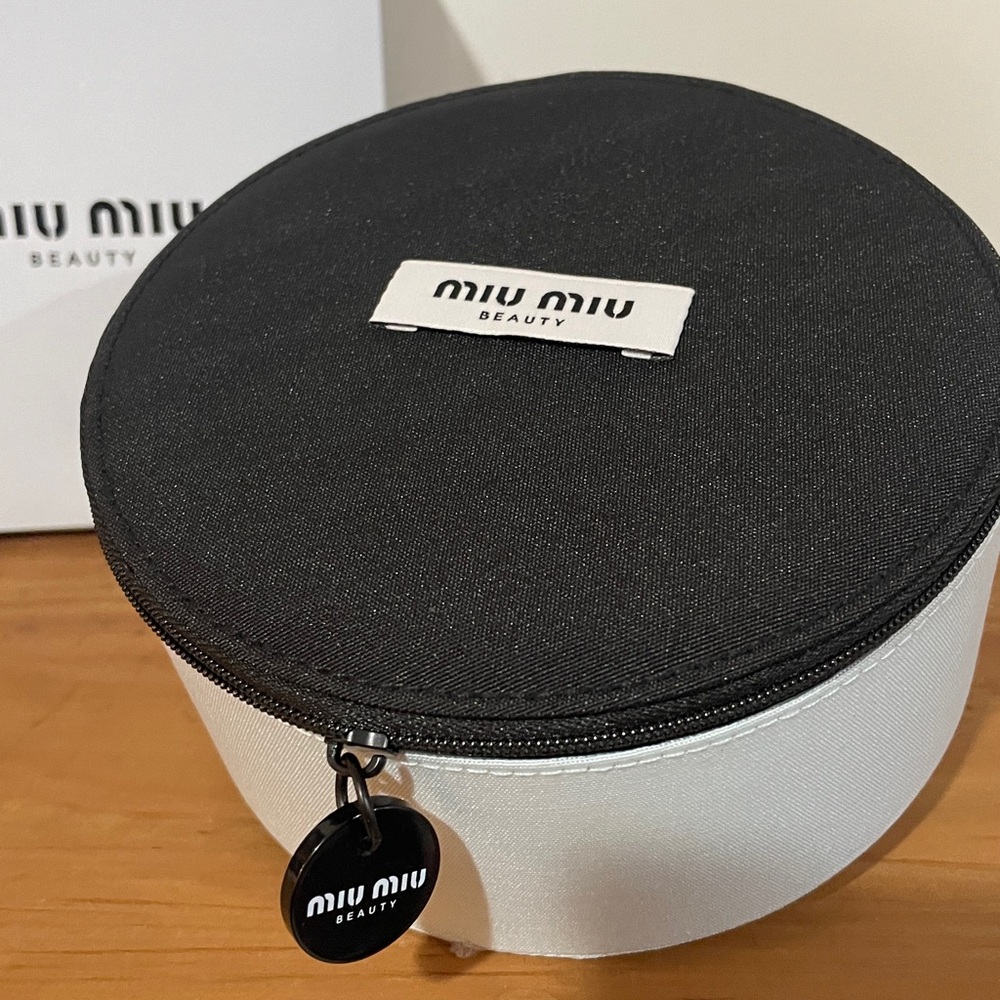 Miu Miu Two-Tone Round Cosmetic Case in Black & miu miu Sky Blue